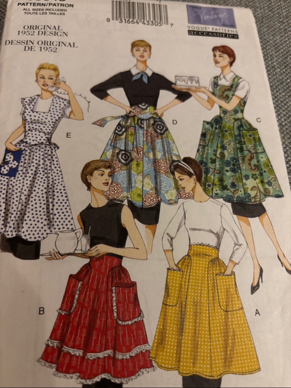 Vogue Aprons, specifically pattern V8643, which features a vintage 1952 design.